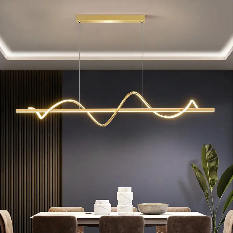 Gold-colored decorbites led chandelier pendant with sleek wave design and minimalist rectangular fixture for modern interiors