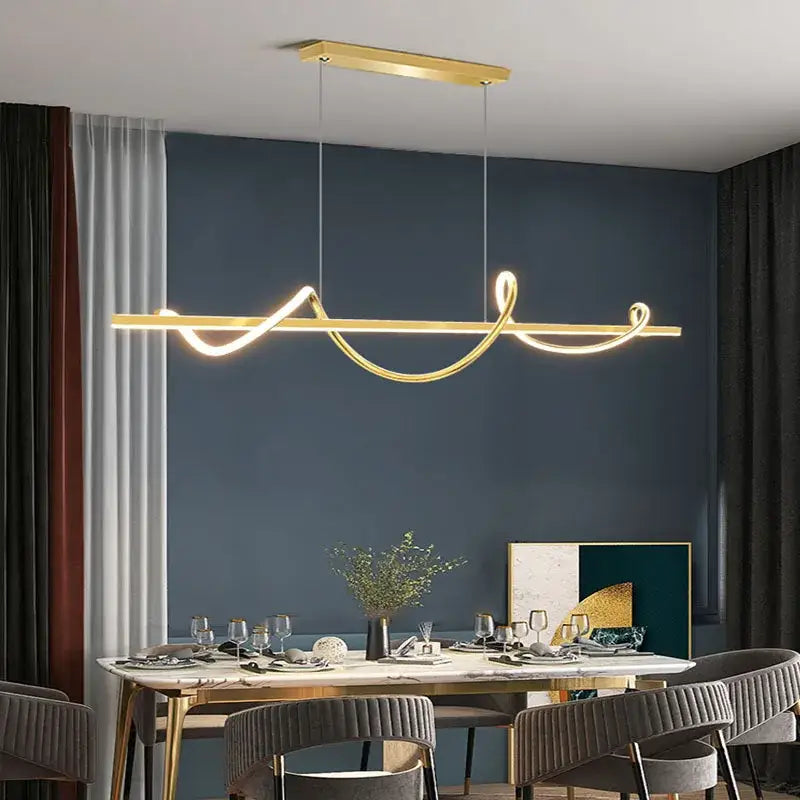 Gold-colored DecorBites LED chandelier pendant with sleek curved light strips for modern dining kitchen lighting