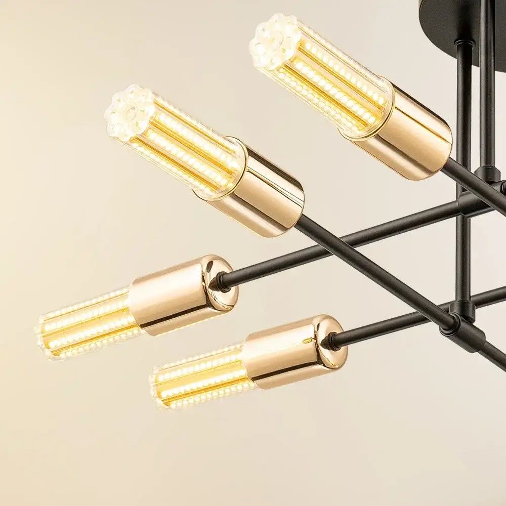 Modern decorbites led chandelier with black metal arms and gold-toned cylindrical led lights for bedroom dining room