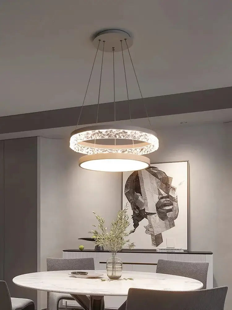 Modern DecorBites led chandelier pendant light with sleek double-ring design, clear crystal accents, and warm diffuser