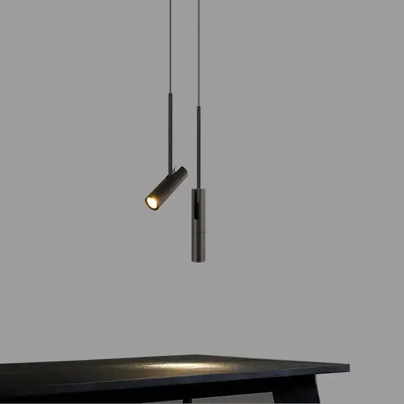 Modern black cylindrical pendant lighting by decorbites emitting warm glow ideal for home dining restaurant and bar chandelier pendant lighting