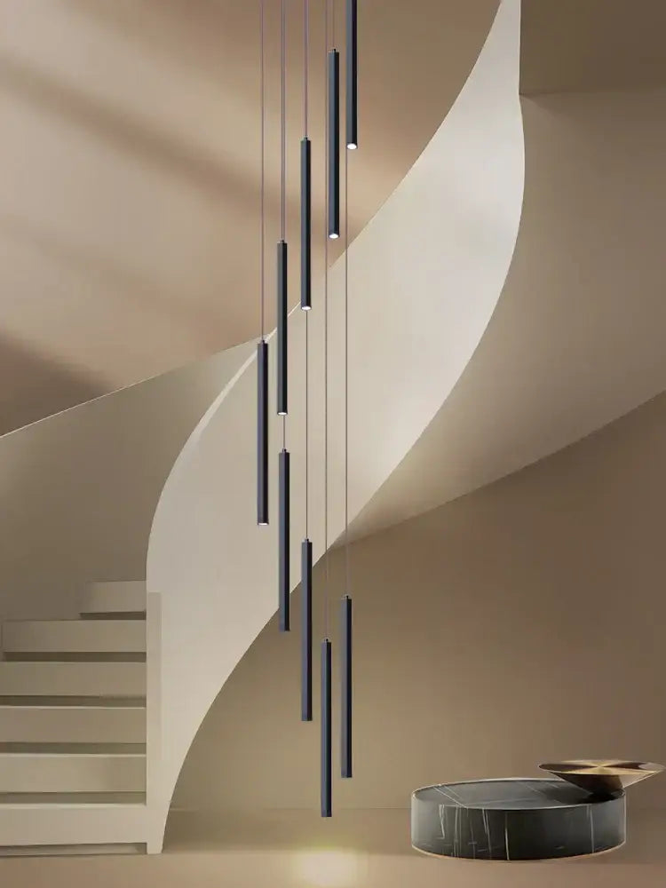 Modern black cylindrical decorbites led chandelier stairs pendant lights hanging vertically above staircase for hotel lobby
