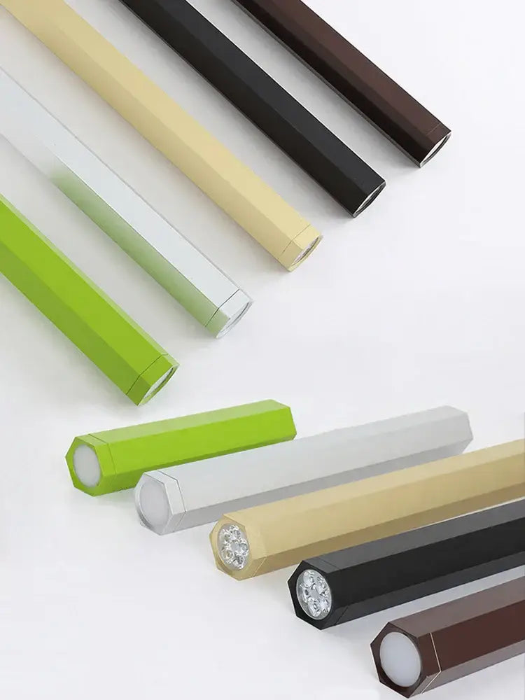 A sleek hexagonal matte finish flashlight in black white green and beige shown with decorbites led chandelier stairs pendant