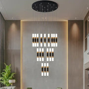 Modern black and gold acrylic decorbites led chandelier stairway lamp with cylindrical design and circular ceiling mount