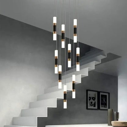 Modern black and gold acrylic decorbites led chandelier stairway lamp with cylindrical pendant lights above staircase