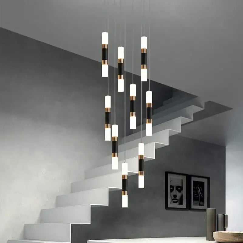 Modern black and gold acrylic decorbites led chandelier stairway lamp with cylindrical pendant lights above staircase