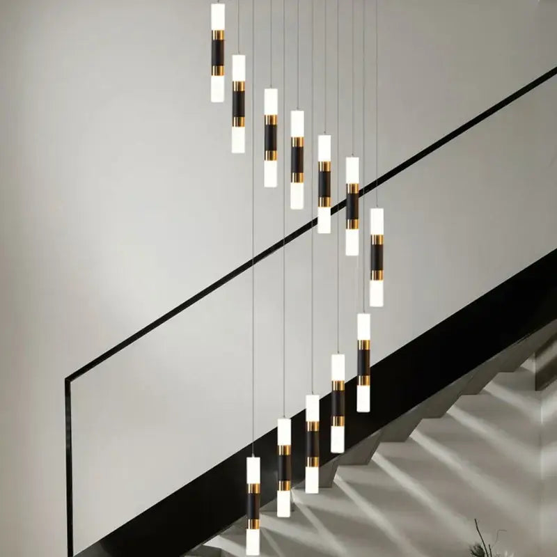 Modern minimalist decorbites led chandelier with white and black acrylic shades and gold accents for stairway lighting