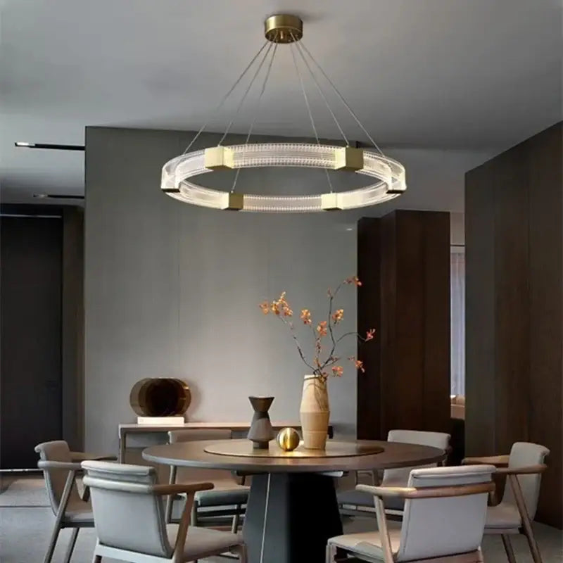 Modern circular decorbites led chandelier with gold-toned frame and clear crystal accents for living room lighting