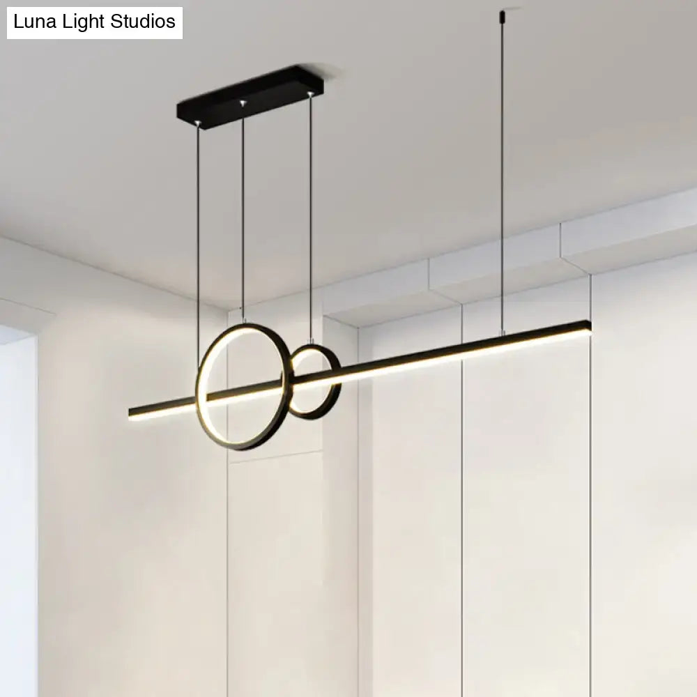 Modern black metal pendant light with sleek circular rings and linear led bar warm white third for restaurants