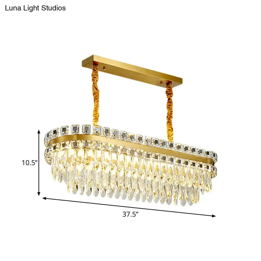Gold-finished oval led crystal light fixture with cascading clear crystal droplets and rectangular top bar for dining room