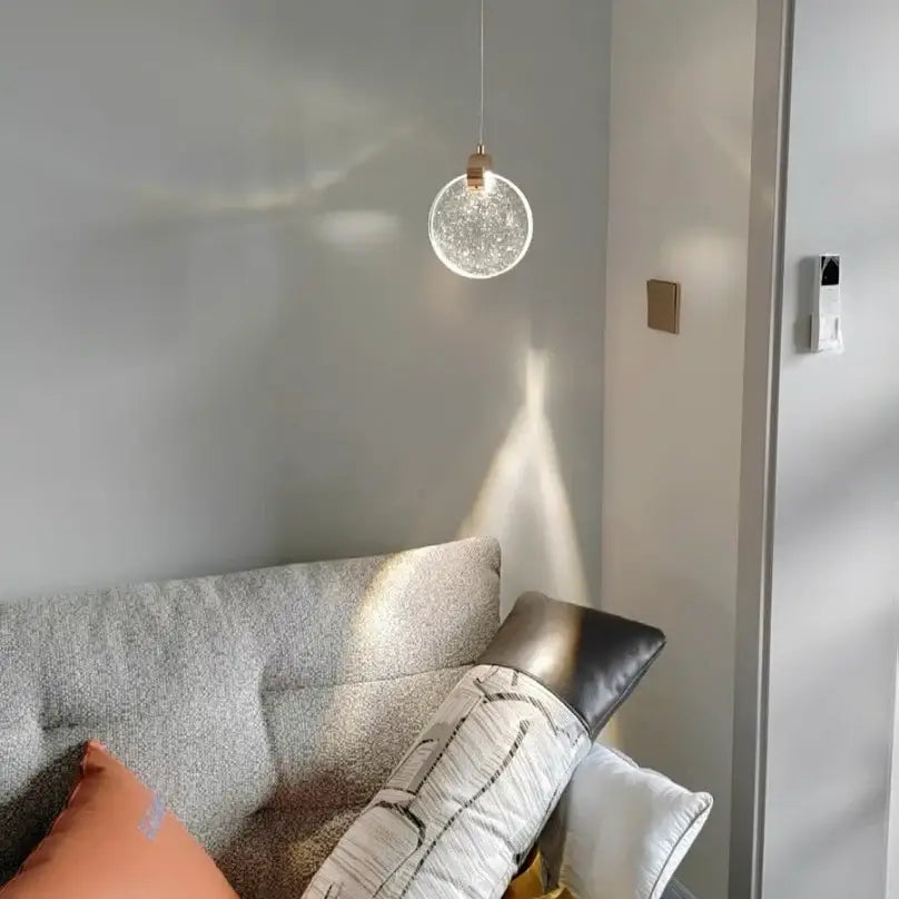 DecorBites™ led crystal pendant light with a crackled glass sphere and rose gold fixture for bedroom and bathroom