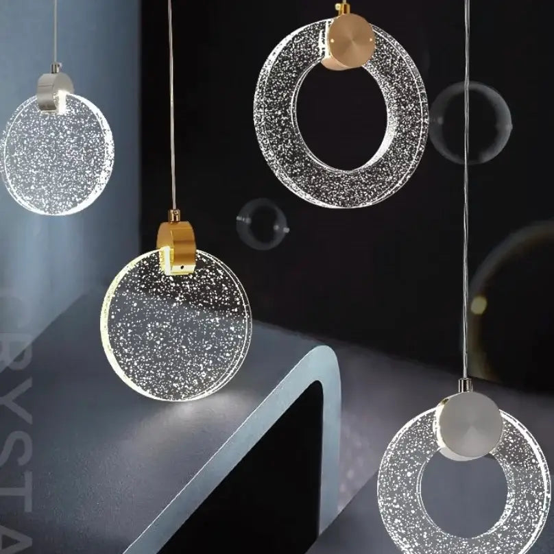 Modern circular decorbites™ led crystal pendant light with clear glass and gold metal fixtures for bedroom and bathroom use