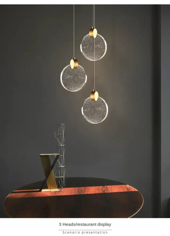 Three spherical led crystal pendant lights with gold-toned fixtures for bedroom and bathroom by DecorBites