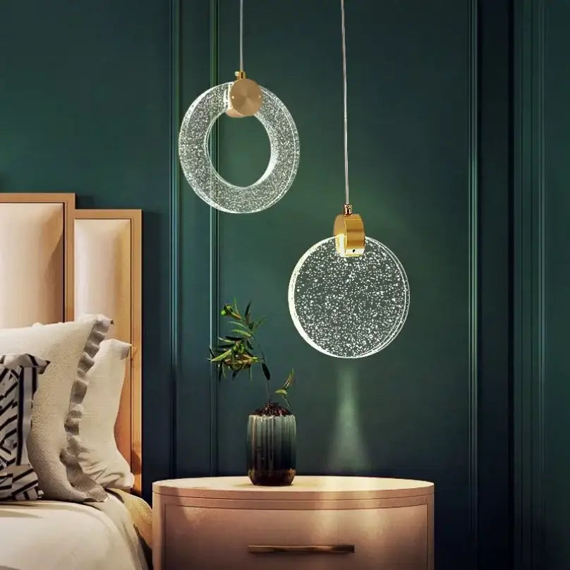 Two modern circular led crystal pendant lights with sparkling glass and gold-toned fixtures for bedroom and bathroom