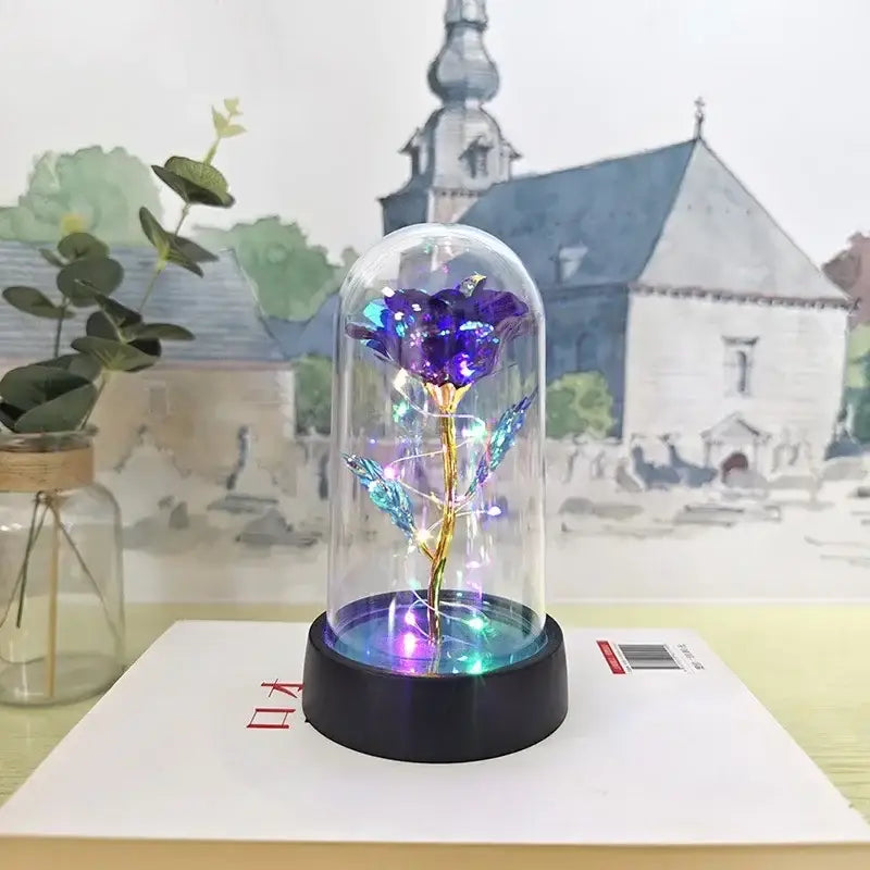 DecorBites™ LED eternal rose light with glowing purple rose, golden stem, and blue leaves in glass dome for weddings