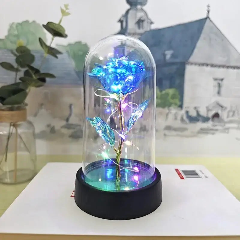 DecorBites™ eternal rose light featuring a glowing blue rose with embedded LED lights in a glass dome base