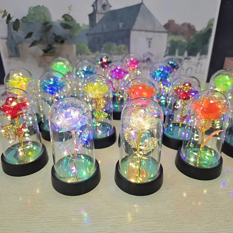 Decorbites™ eternal rose light with colorful led-lit roses encased in clear glass domes with black bases for weddings and valentine’s day