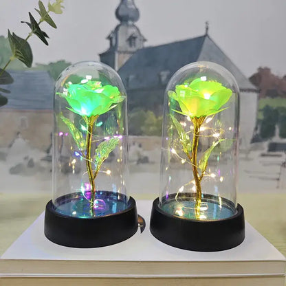 Decorbites™ eternal rose light featuring two green led roses with golden stems in glass domes on black bases for valentine’s day