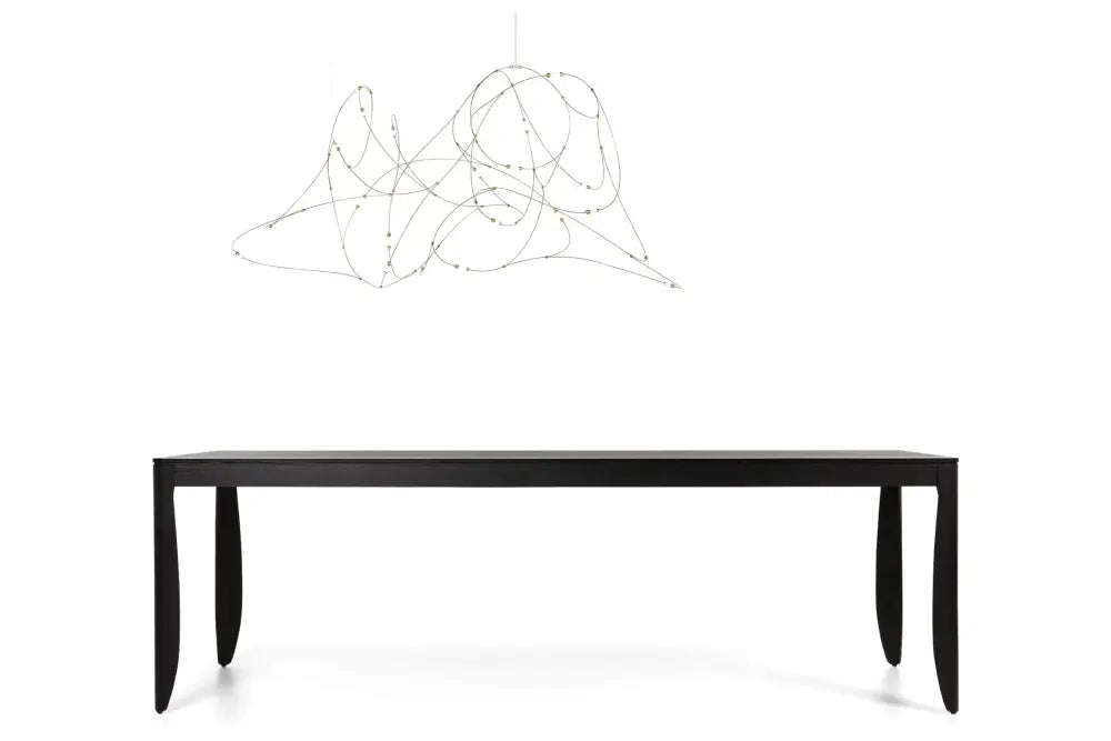 Black minimalist dining table with sleek curved legs complements decorbites™ led firefly chandelier featuring engineering minimal design
