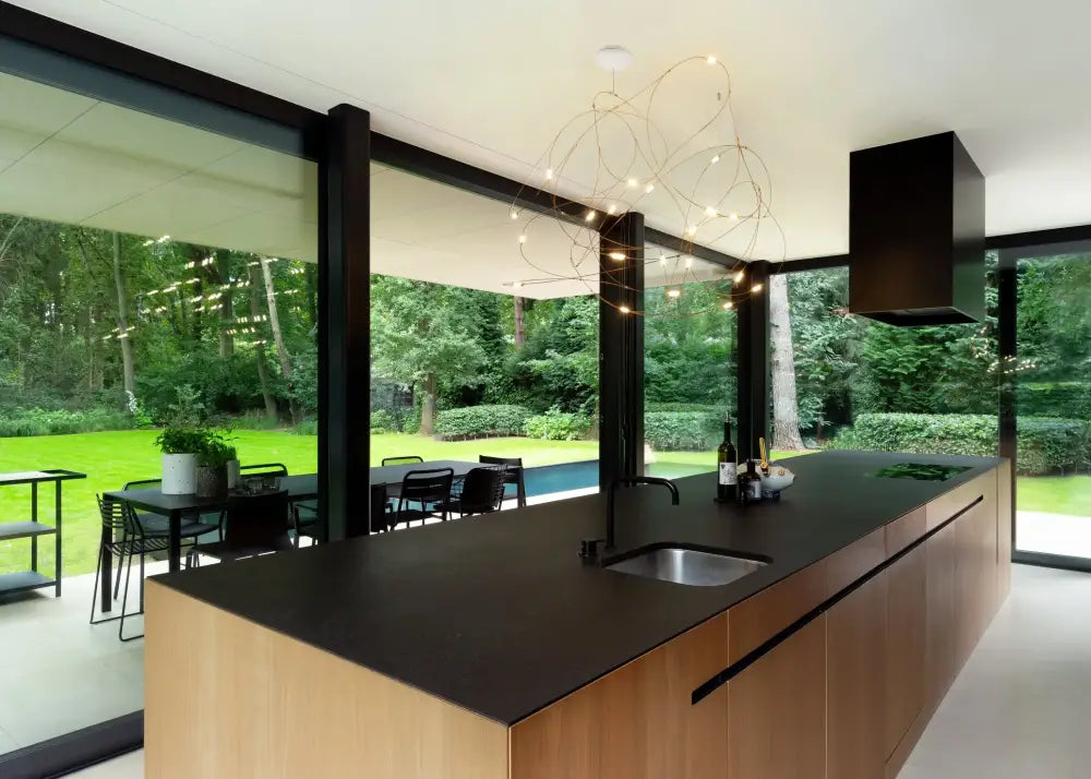 DecorBites™ LED Firefly chandelier with black countertop featuring sleek modern design and integrated sink for kitchen use