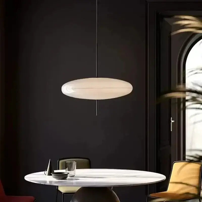 Minimalist white decorbites led flying saucer pendant lights with sleek oval shape and matte finish for dining room use
