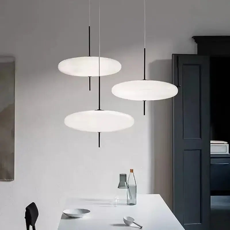Three minimalist decorbites led flying saucer pendant lights with frosted white disc shades for dining and living rooms