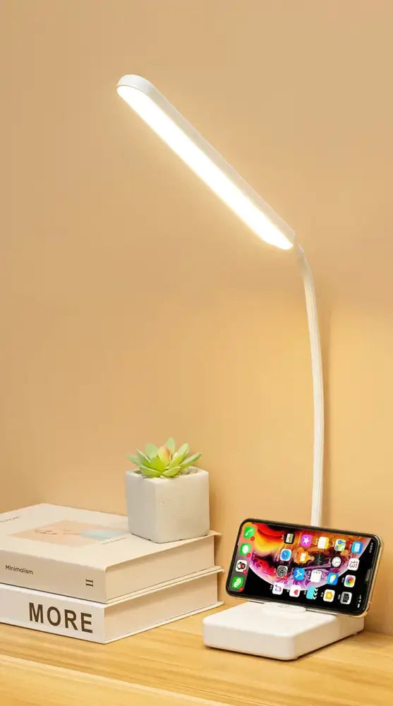 White decorbites led foldable desk lamp with flexible gooseneck and integrated phone charging base for versatile use