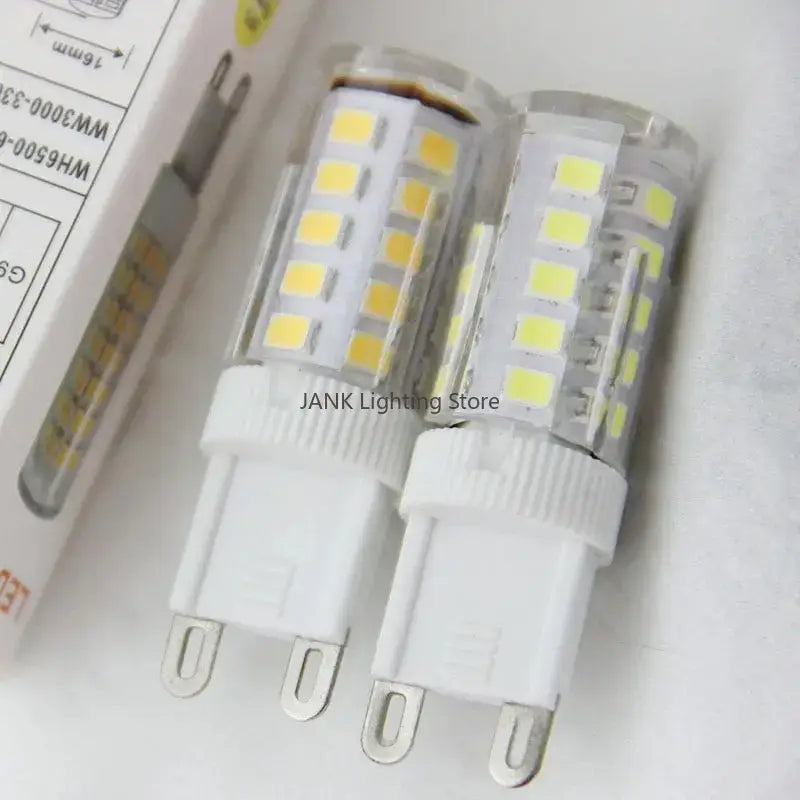 Two white decorbites led e14 85-265v bulbs with clear glass and yellow leds for crystal chandeliers and floor lights