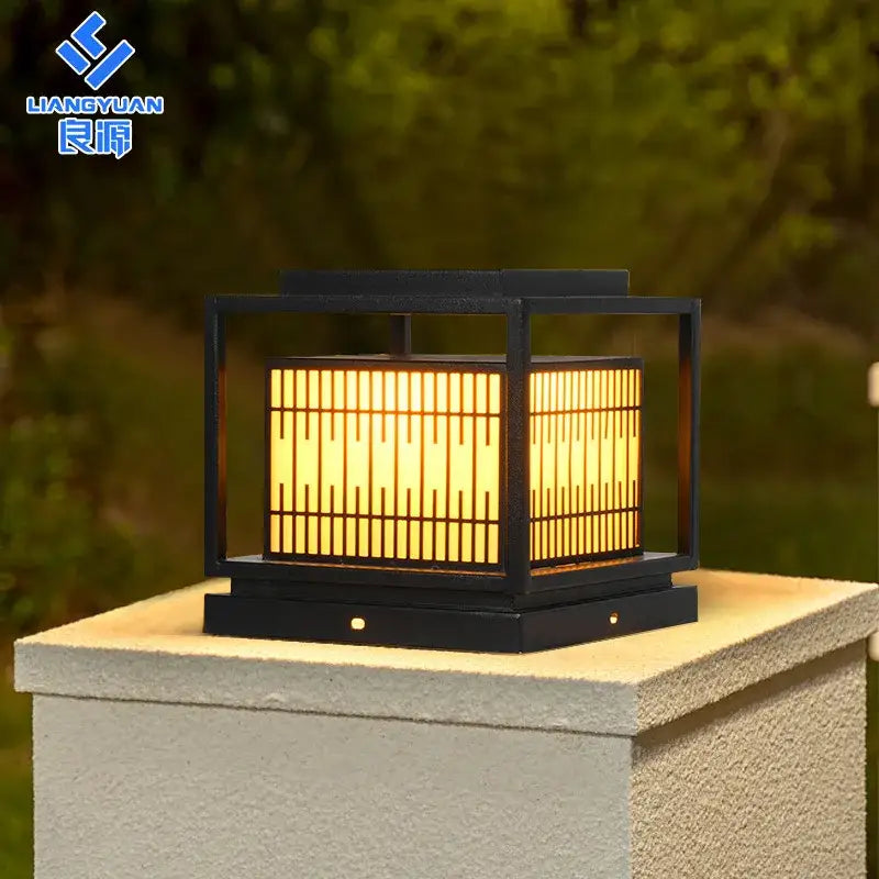 Black-framed DecorBites LED garden light with warm yellow light through vertical slats for outdoor landscapes