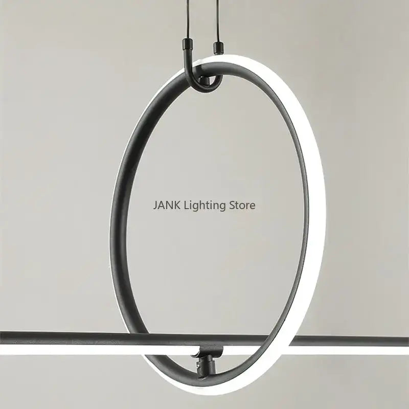 Modern black-framed circular decorbites led geometric pendant light with glowing white led ring for living room decor
