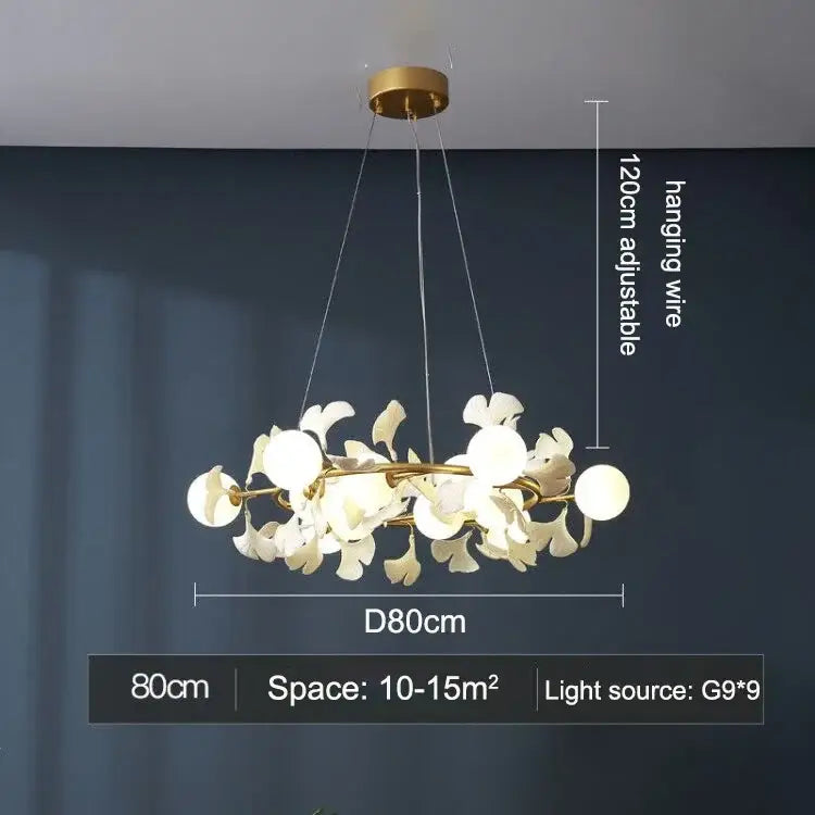 Gold-toned DecorBites LED Gingko ceiling chandelier with white petal-shaped glass shades in circular design for living room