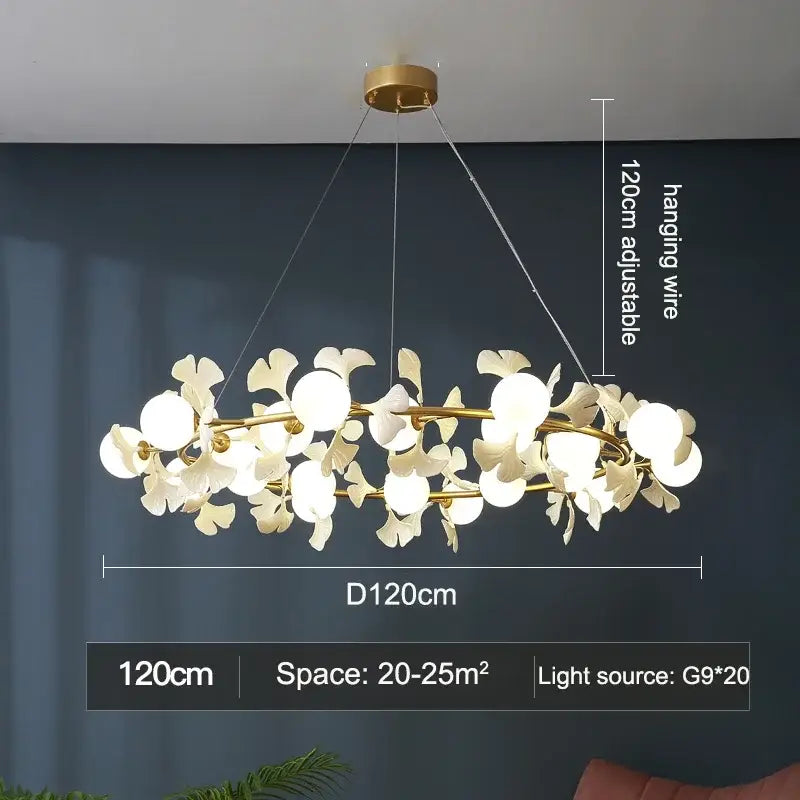 A modern 120cm gold-toned metal decorbites led gingko ceiling chandelier with white ceramic flower-shaped fixtures