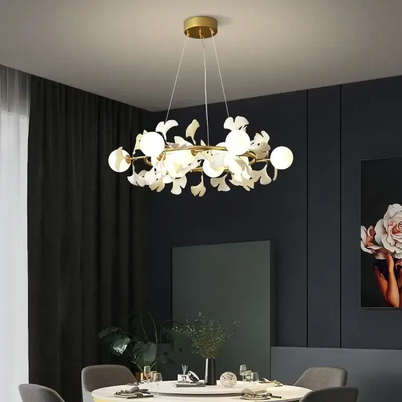 A modern ceiling chandelier by decorbites led gingko with gold frame and white petal-shaped glass shades