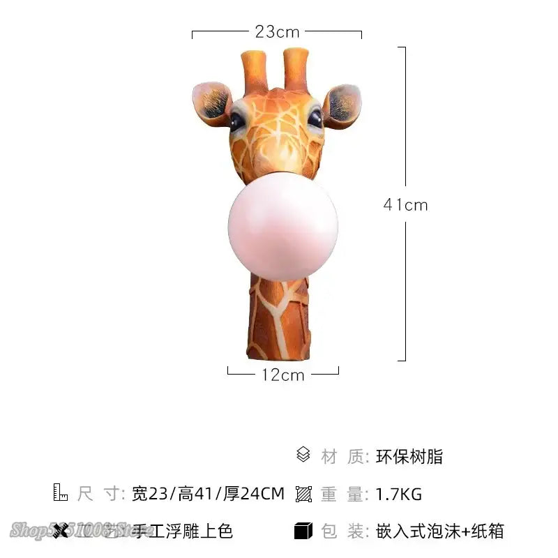 A decorbites led giraffe wall lamp featuring a detailed orange and brown spotted giraffe blowing a pink bubble gum bubble