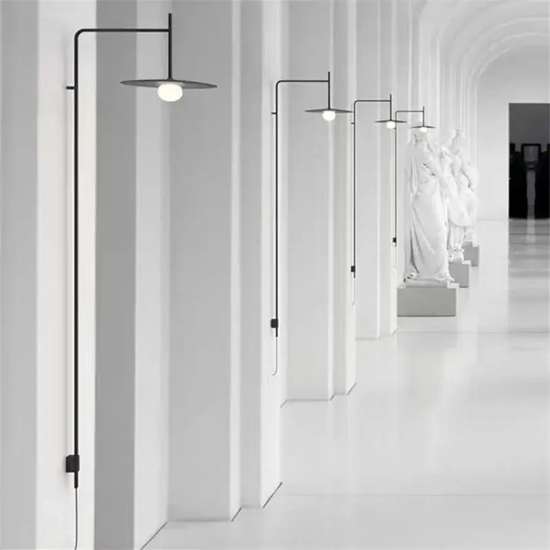 Black minimalist DecorBites™ LED glass art wall lamp with slender vertical arm and circular shade for living room and studio