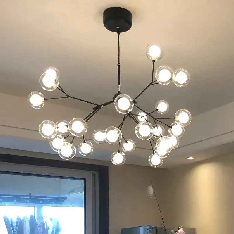 Modern black metal DecorBites LED glass ball branch chandelier with clear glass globe bulbs in a branching design