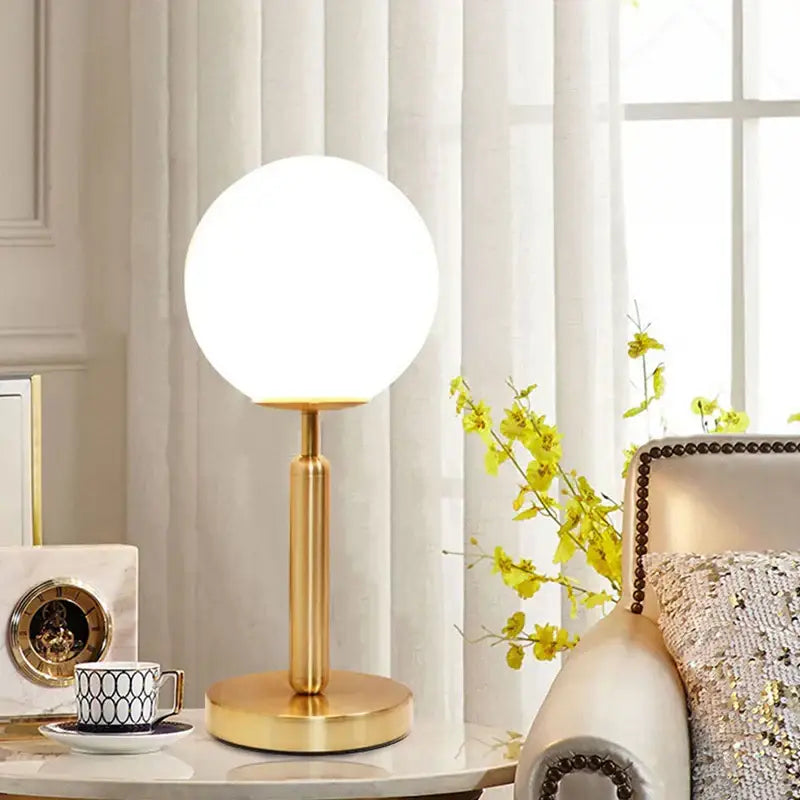 Gold-finished DecorBites LED glass ball table lamp with spherical frosted globe for luxury home decor and offices