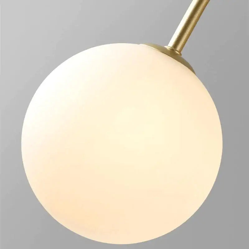 Decorbites led glass ball ceiling chandelier featuring a warm frosted glass globe with a sleek brass stem