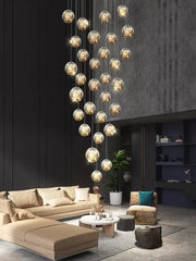 A decorbites led glass ball chandelier with multiple spherical glass globes emitting warm golden light for villa living rooms