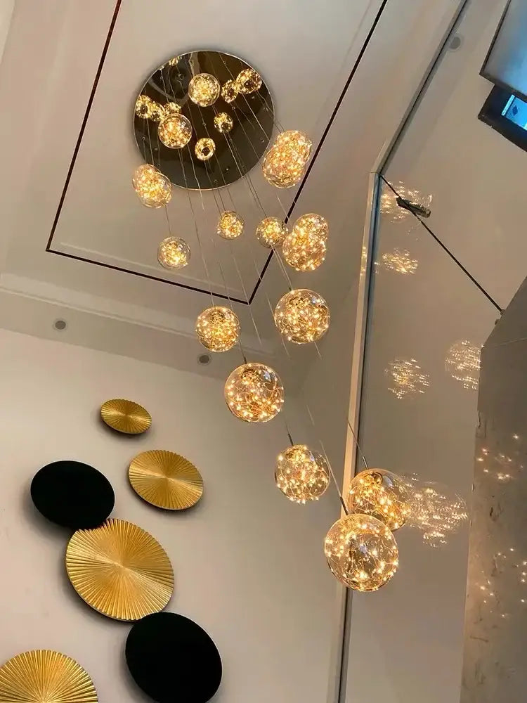 Golden spherical decorbites led glass ball chandelier with textured glass orbs on circular metal frame for duplex villa living room