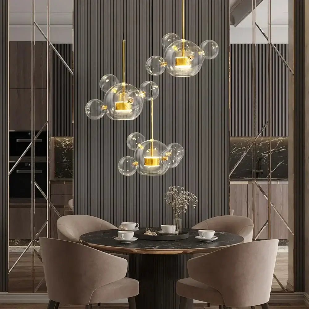 Gold-toned pendant lights with clear glass bubble design from decorbites led glass ball chandelier for dining room
