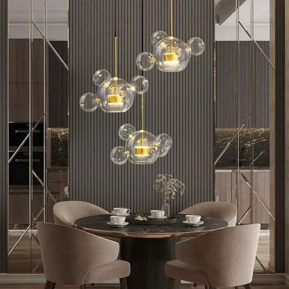 Gold-toned pendant lights with clear glass bubble design from decorbites led glass ball chandelier for dining room