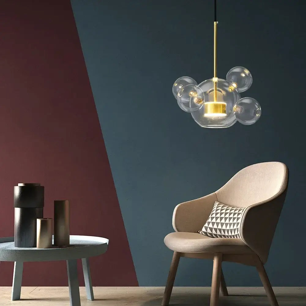 Modern glass bubble pendant lights with gold-toned fixture and slender rod from DecorBites LED glass ball chandelier series