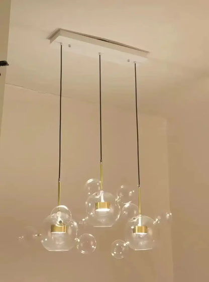 Modern decorbites led glass pendant lights with gold-toned metal accents and black cords for living and dining rooms