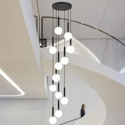 Modern black DecorBites LED glass ball chandelier with multiple white spherical LED glass balls for stylish indoor lighting