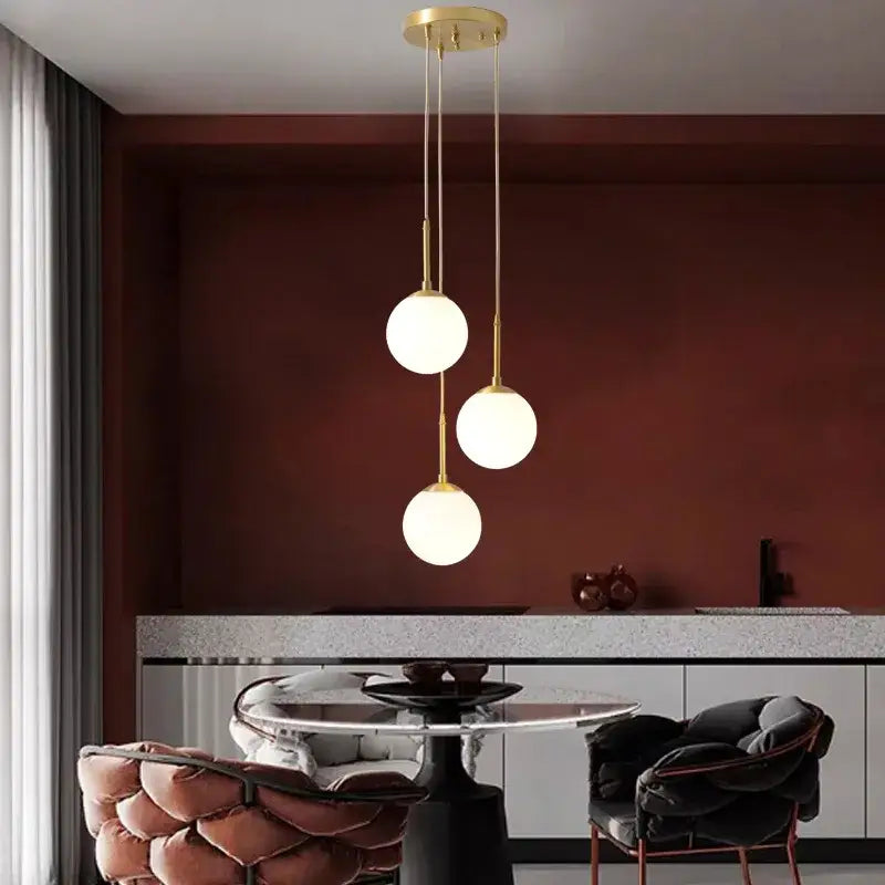 Gold-toned DecorBites LED glass ball chandelier with three frosted glass bulbs for stylish indoor lighting