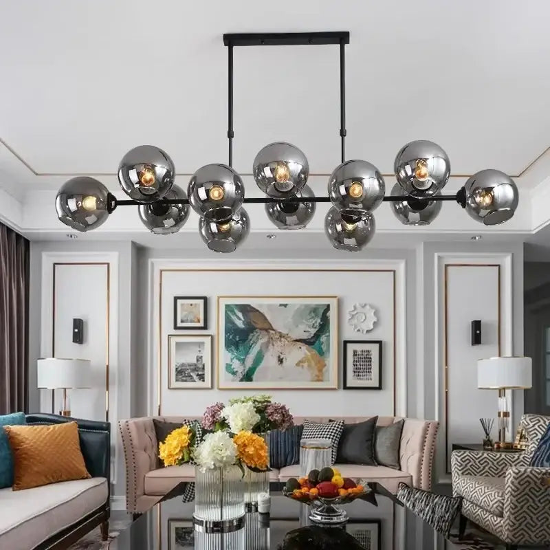 Modern chrome-finished spherical pendant light with a sleek black metal frame decorbites led glass ball fixture