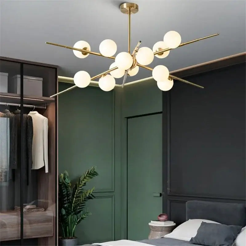 Modern gold-toned DecorBites LED glass pendant light with frosted glass globe balls in starburst design for living room