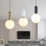 Three modern pendant lights with spherical frosted glass shades and gold white black metal fixtures from decorbites led glass ball