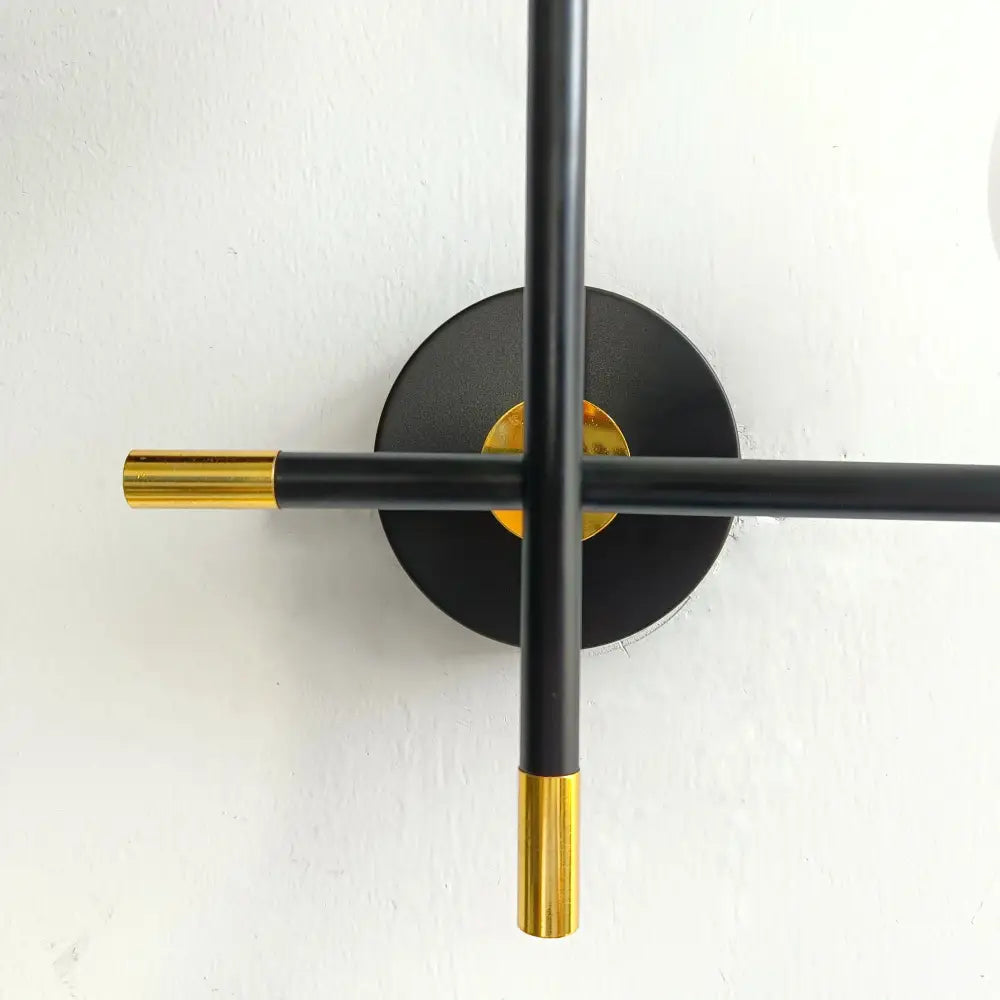 Black and gold minimalist decorbites led glass ball wall lamp with intersecting rods for modern bedroom lighting fixture